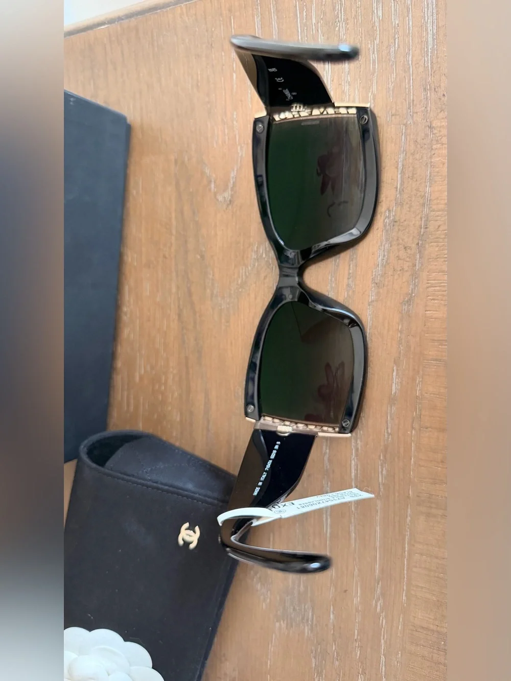 CHANEL Black Cat-Eye Sunglasses with Gold Accent and Gradient Gray Lenses